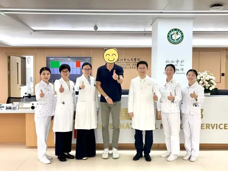 Patient giving banner to doctor